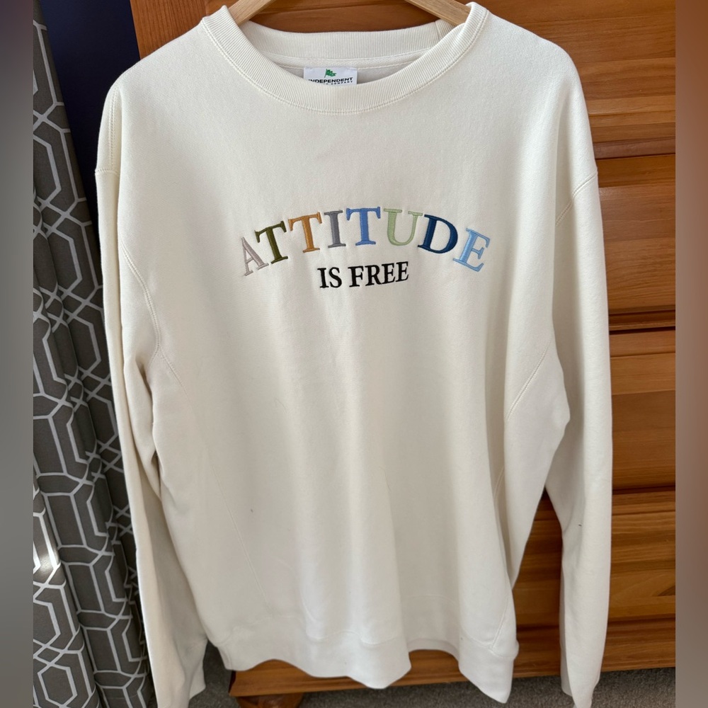 White Sweatshirt with Colorful 'Attitude is Free' Print